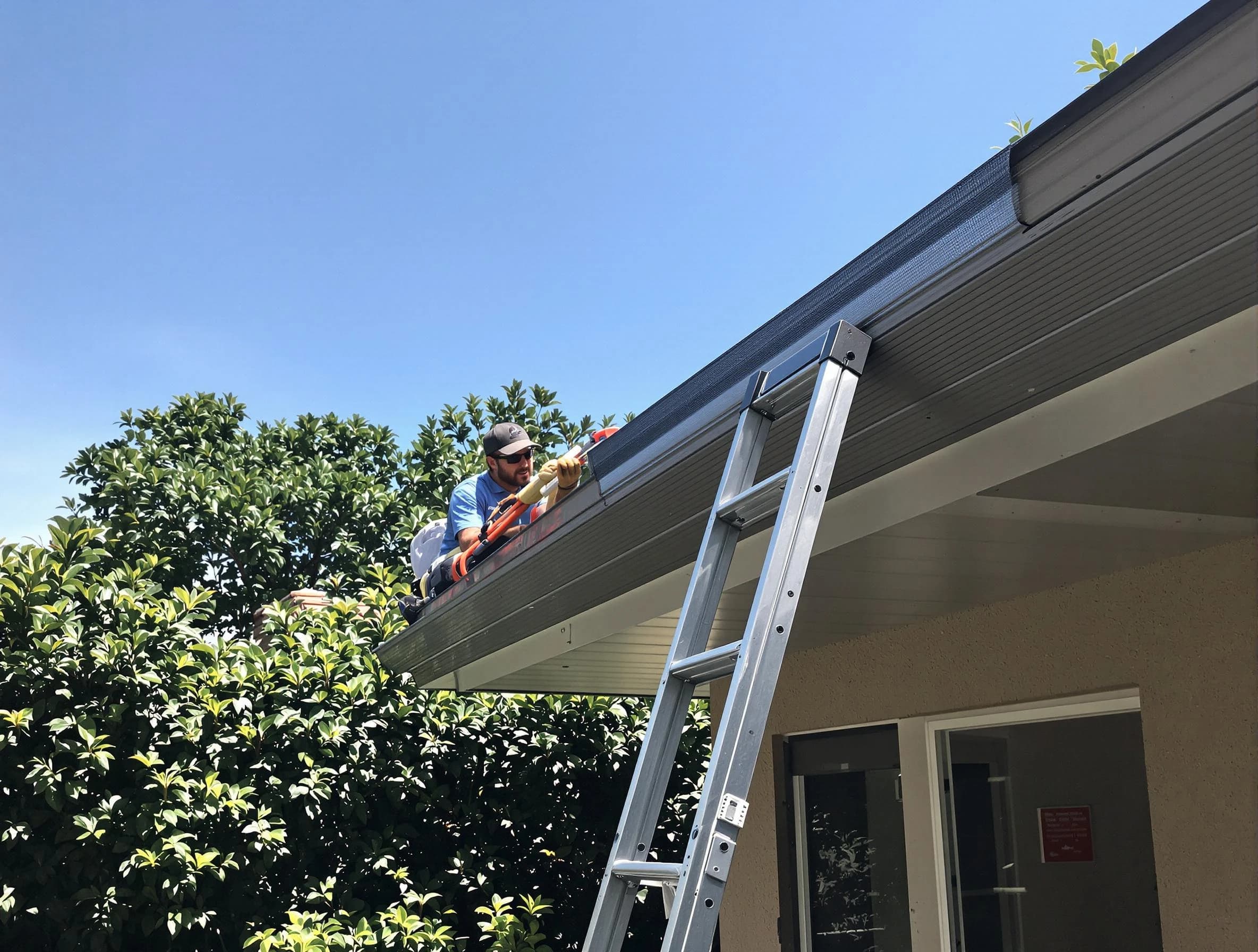 Willowick Roofing Company installing gutter guards for a homeowner in Willowick, OH